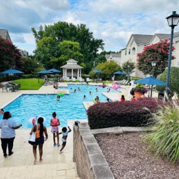 families spending time at a pool