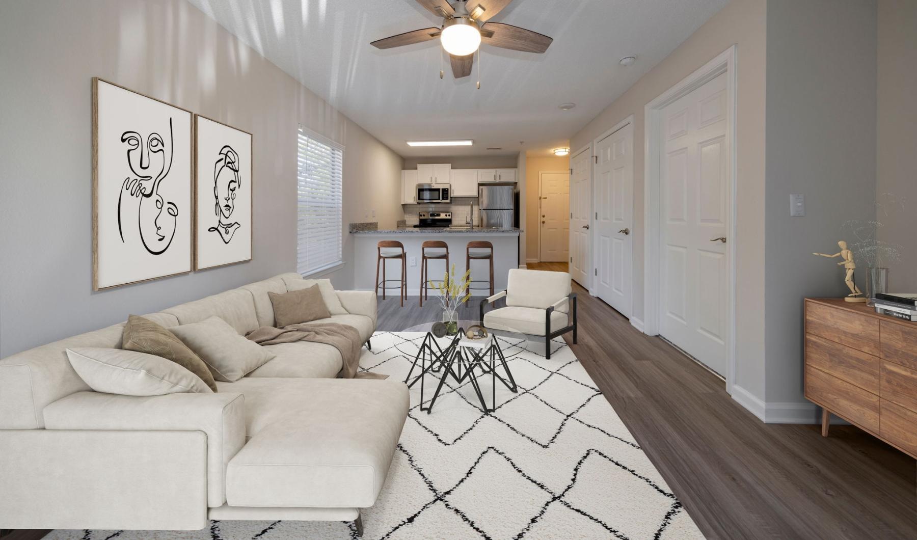 a living room with a white couch and a table